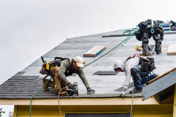 Professional Gutter Installation technician working in Bay City, OR